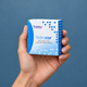 Hands holding hidrocor yearly contact lens packaging