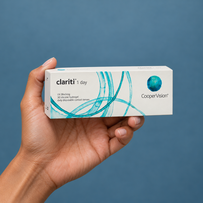 Hands holding clariti contact lens packaging